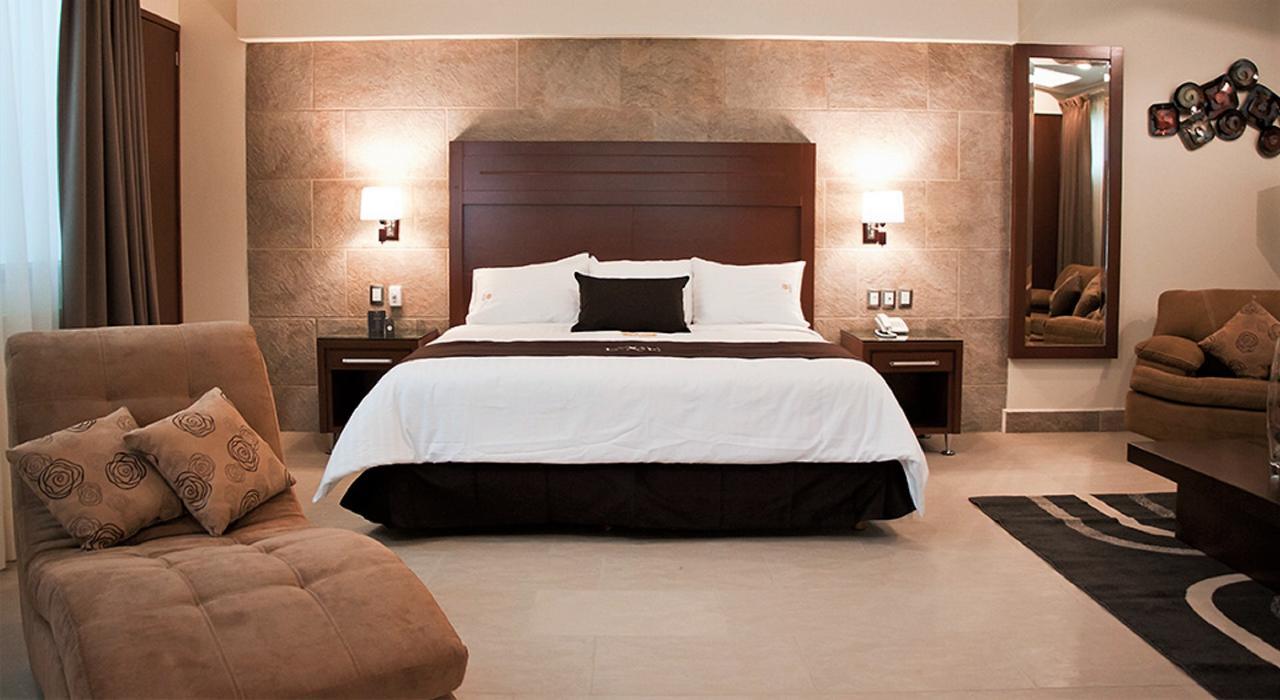 Hotel Ecce Inn&Spa Silao Exterior foto A bedroom at the hotel